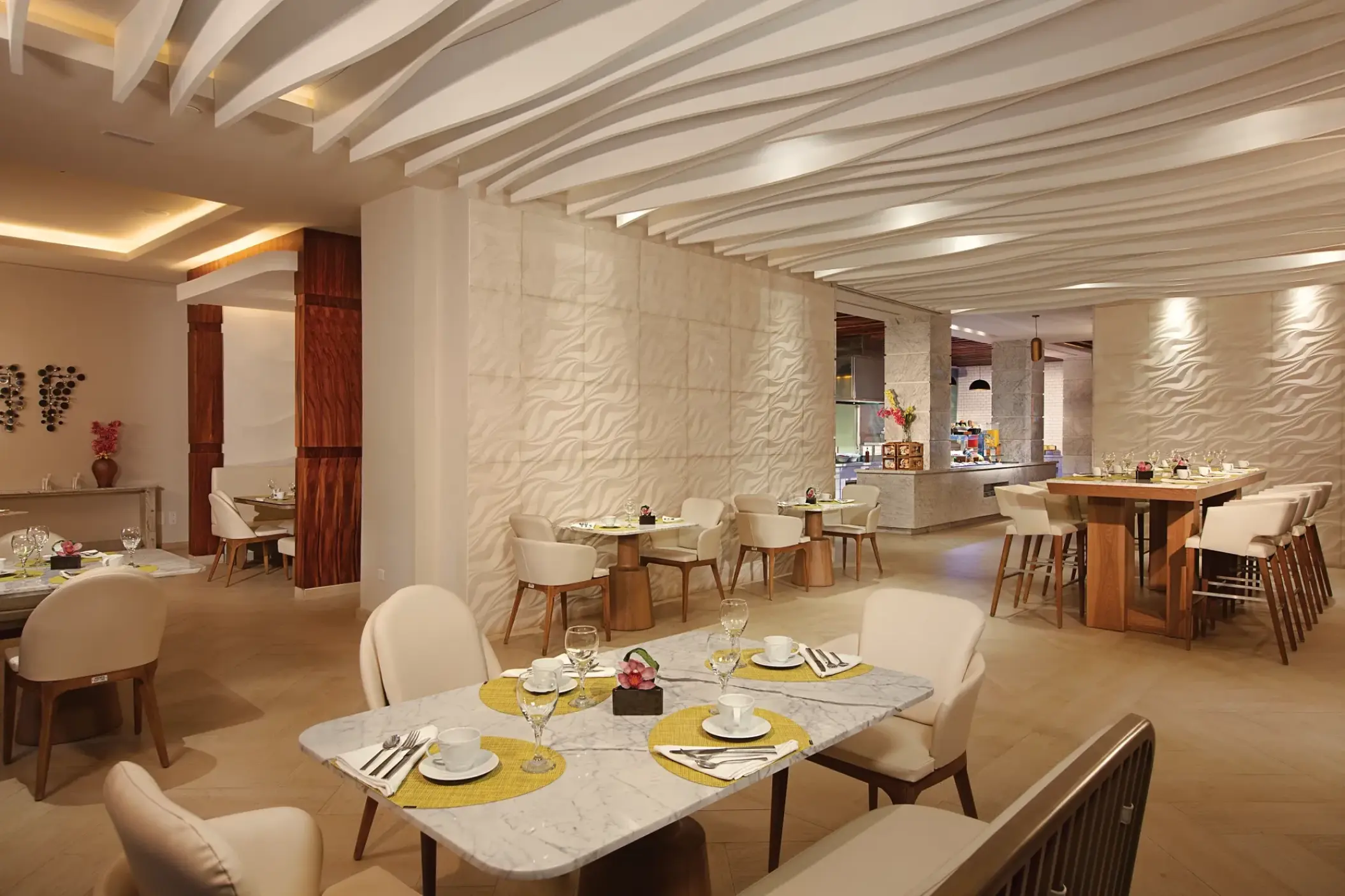 Spoon restaurant dining area with modern white textured walls at Breathless Montego Bay, Montego Bay
