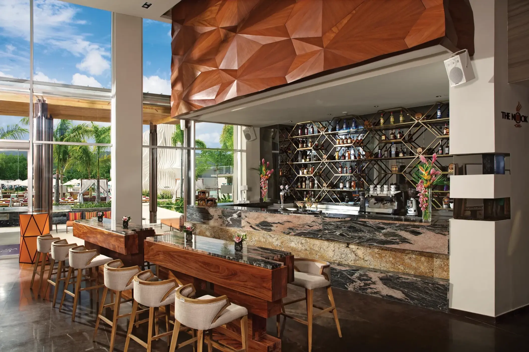 The Nook bar with marble counters and wood accents at Breathless Montego Bay