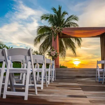 Sunset wedding ceremony setup with a floral wooden gazebo at Breathless Montego Bay, Montego Bay