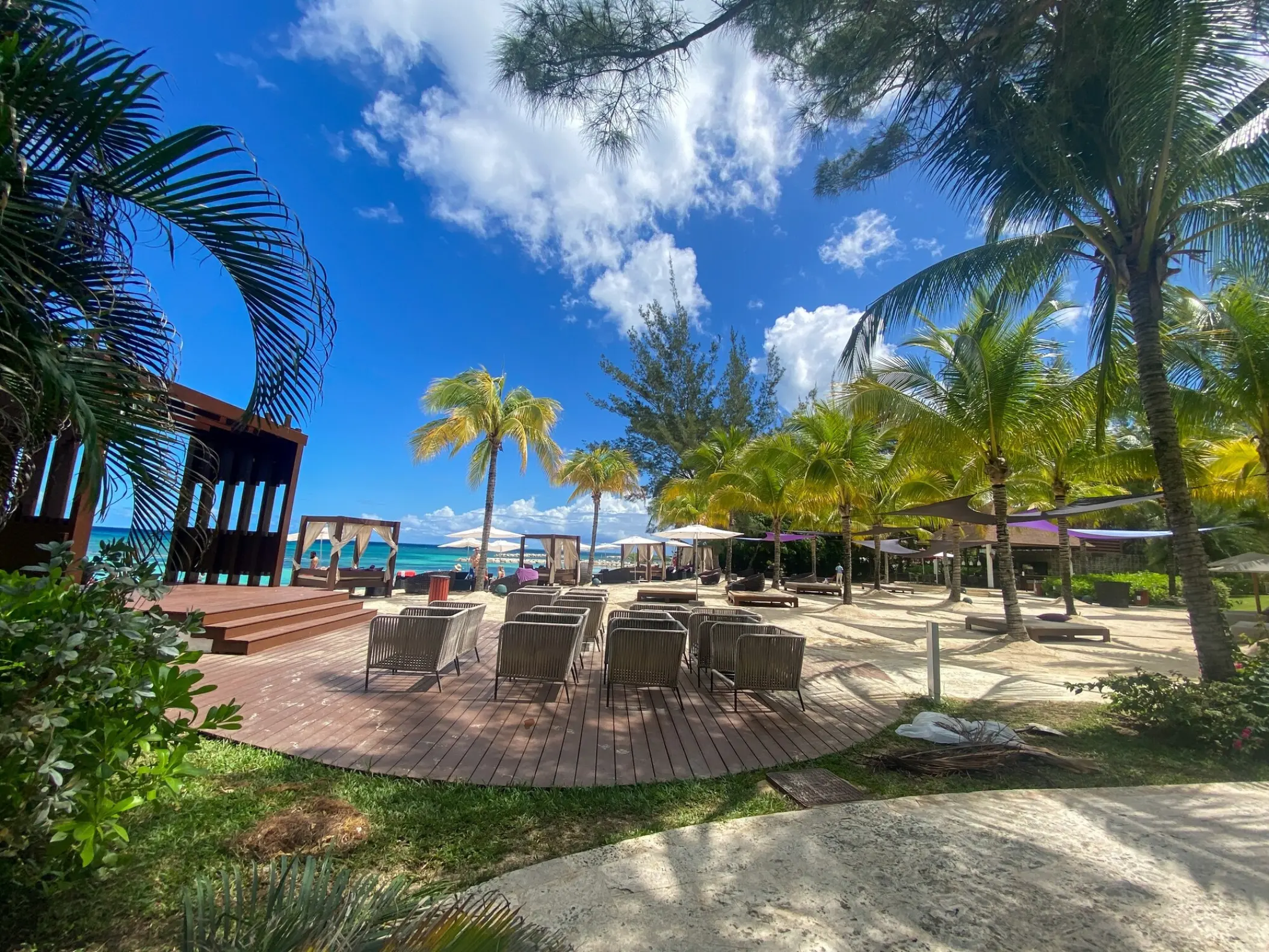 Wooden beachfront wedding gazebo and guest seating at Breathless Montego Bay