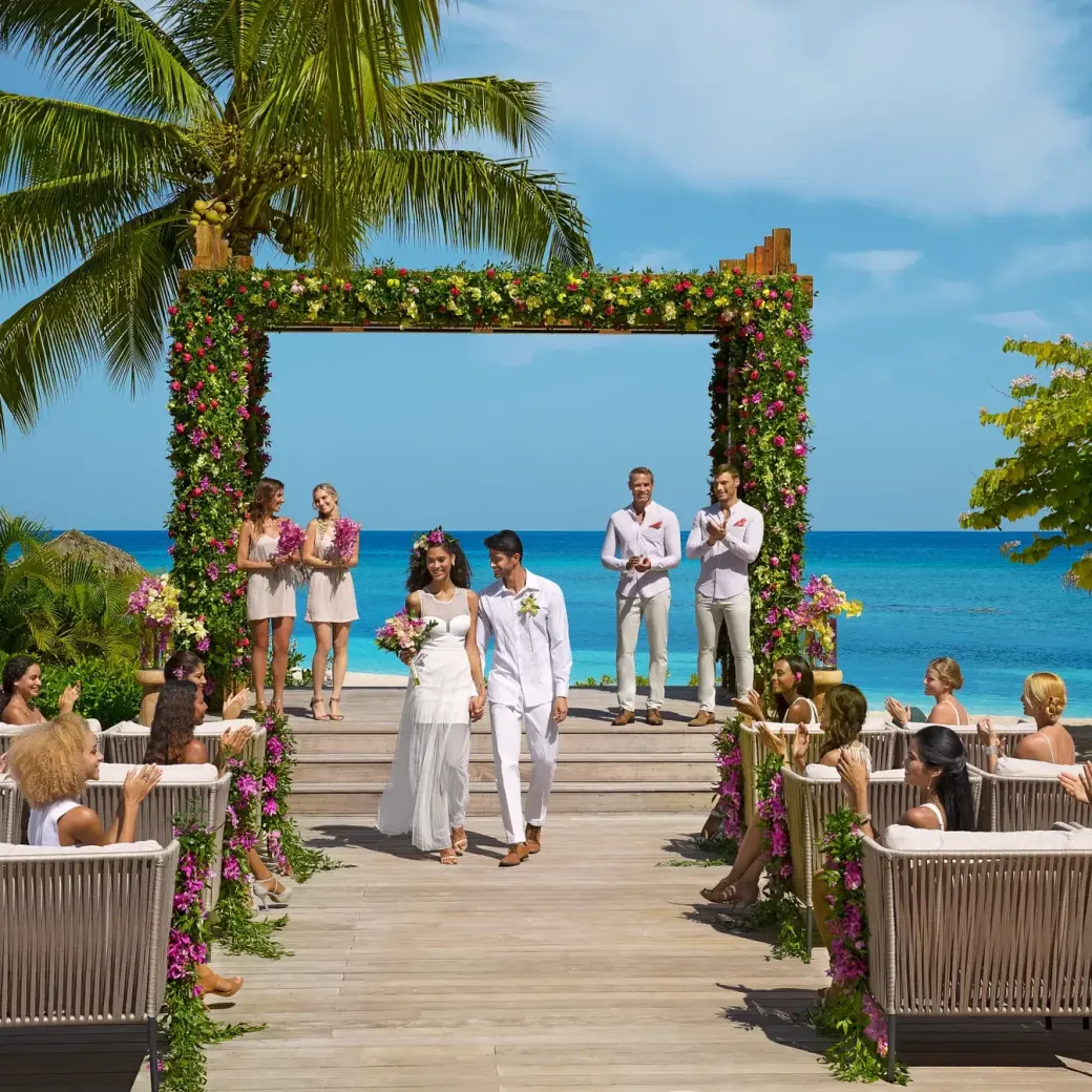 Beachfront wedding ceremony on a wooden deck at Breathless Montego Bay