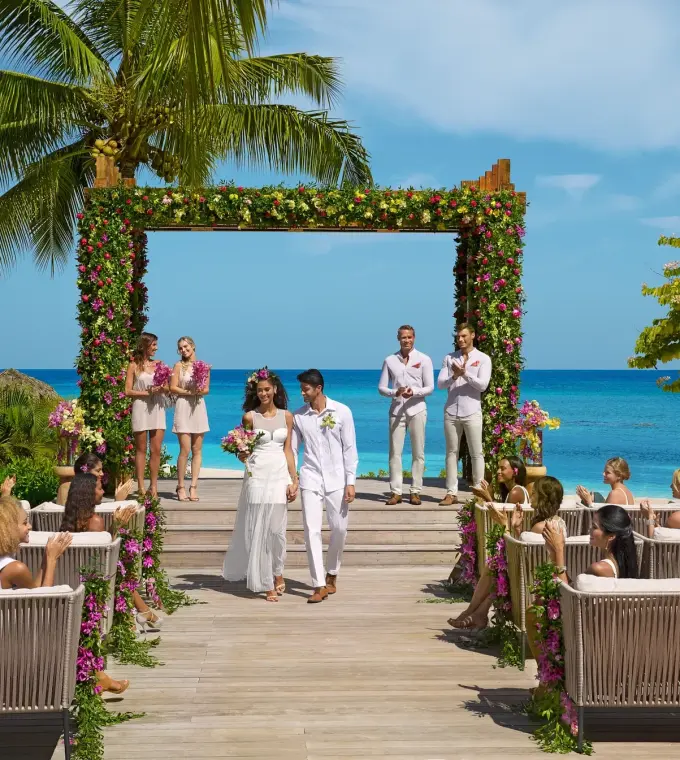 Beachfront wedding ceremony on a wooden deck at Breathless Montego Bay