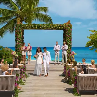 Beachfront wedding ceremony on a wooden deck at Breathless Montego Bay
