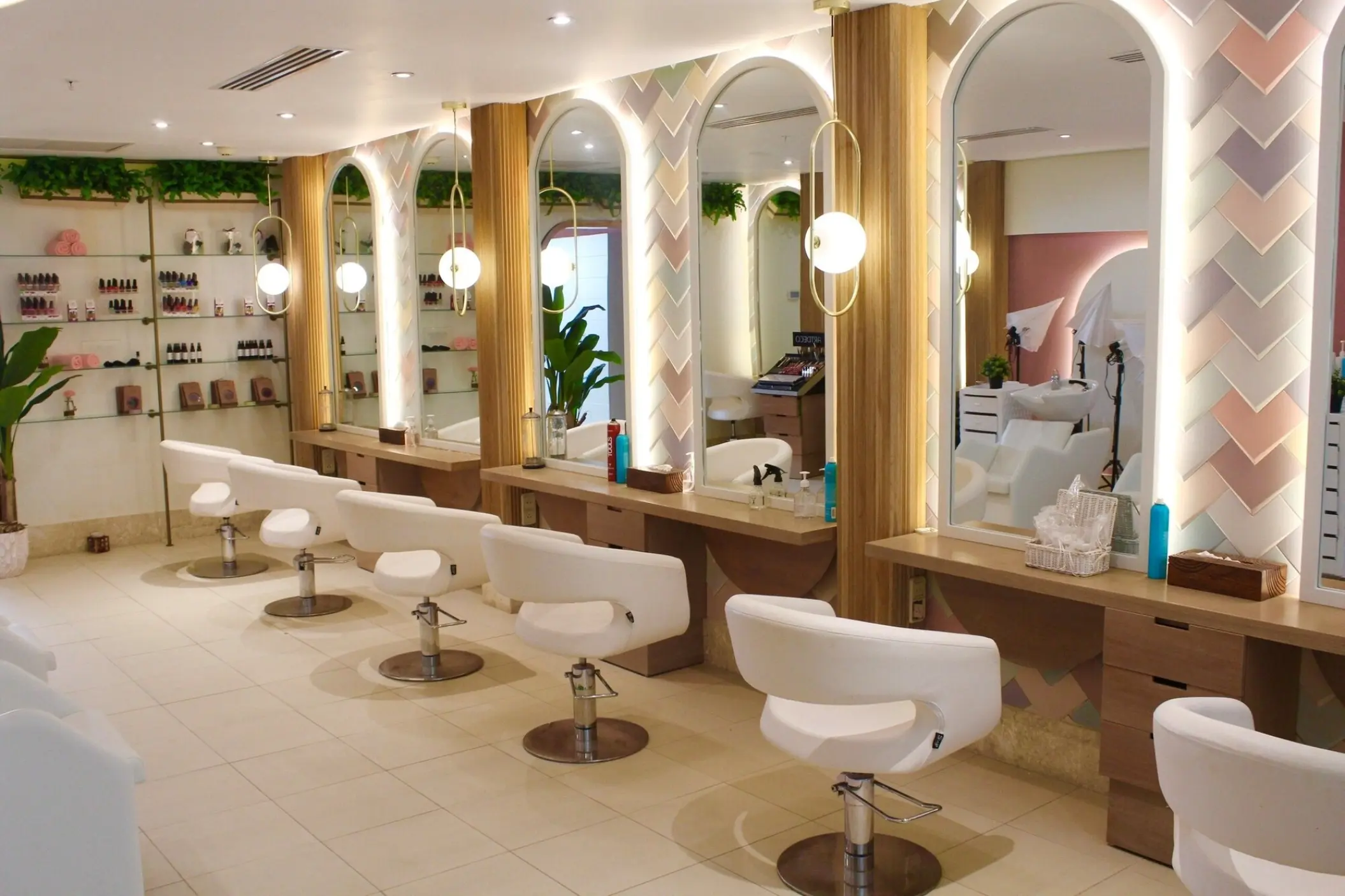 White chairs and arched mirrors at the Breathless Punta Cana beauty salon, Punta Cana