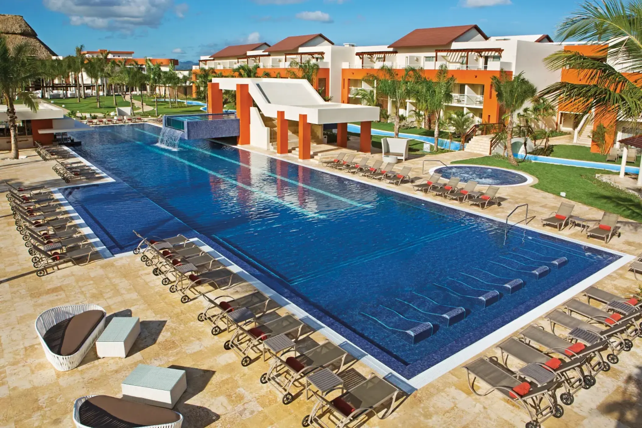 Breathless Punta Cana main swimming pool with lounge chairs and resort buildings, Punta Cana