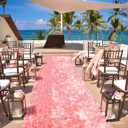 Rooftop wedding ceremony with pink runner and ocean views at Breathless Punta Cana