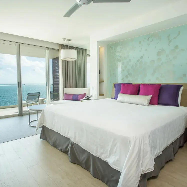 Junior suite with king bed and ocean view balcony at Breathless Riviera Cancun, Riviera Maya