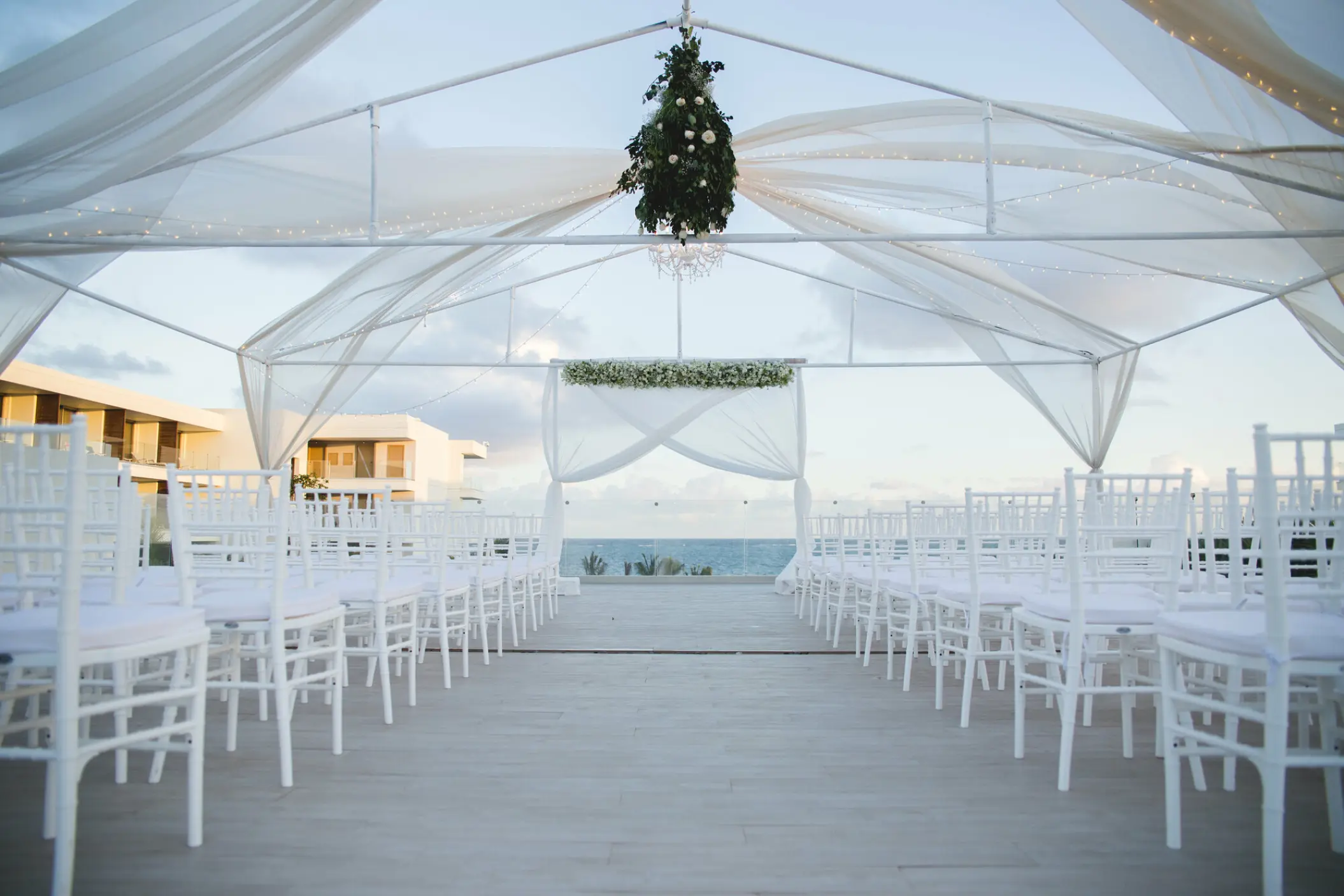 Terrace wedding ceremony under a white canopy at Breathless Riviera Cancun, Riviera Maya