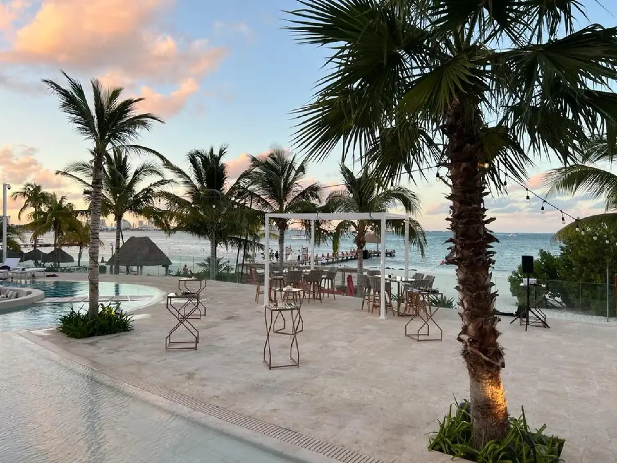 Outdoor wedding reception setup on the pool terrace at Breathless Cancun Soul, Cancun