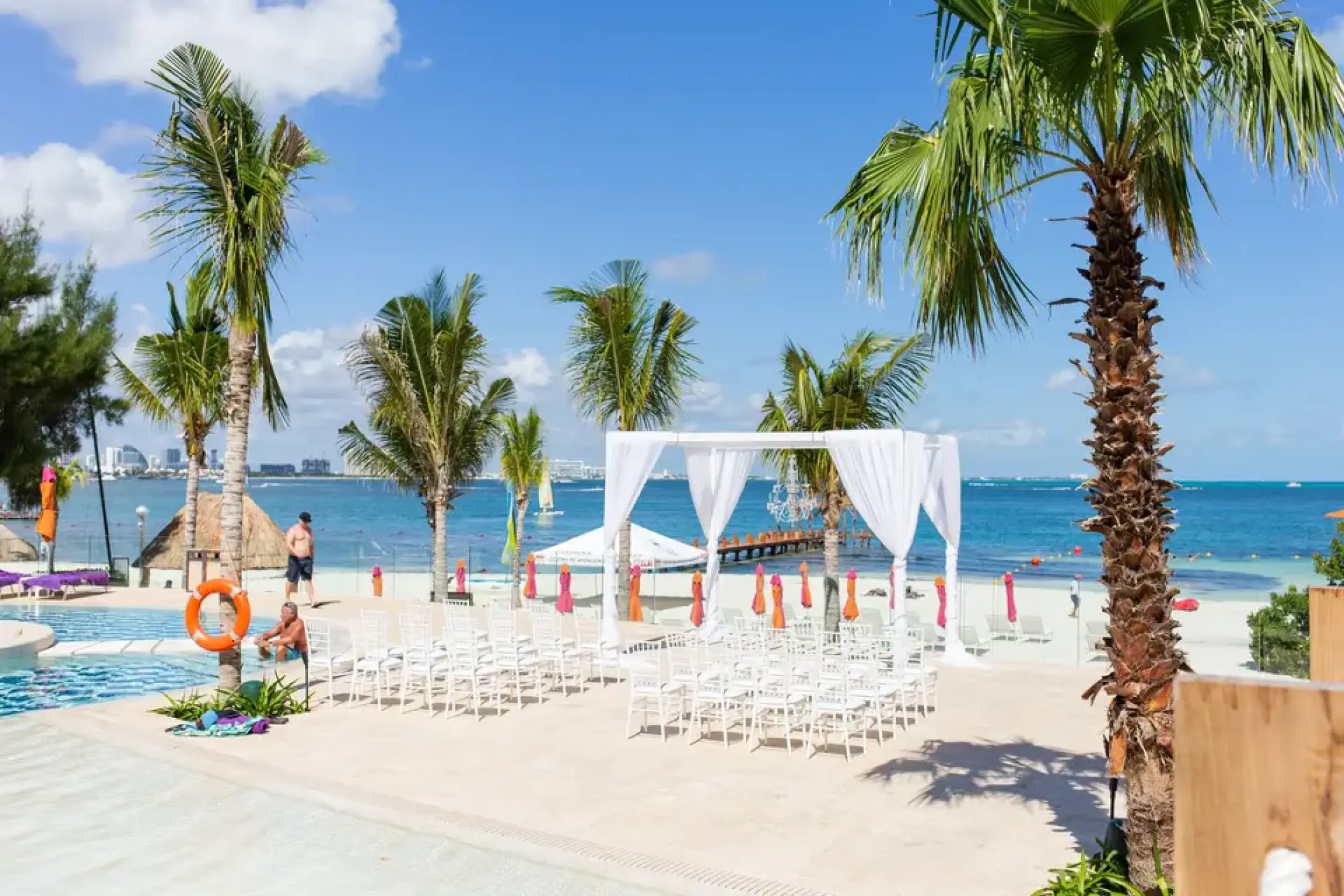 White wedding ceremony setup on the beach at Breathless Cancun Soul, Cancun