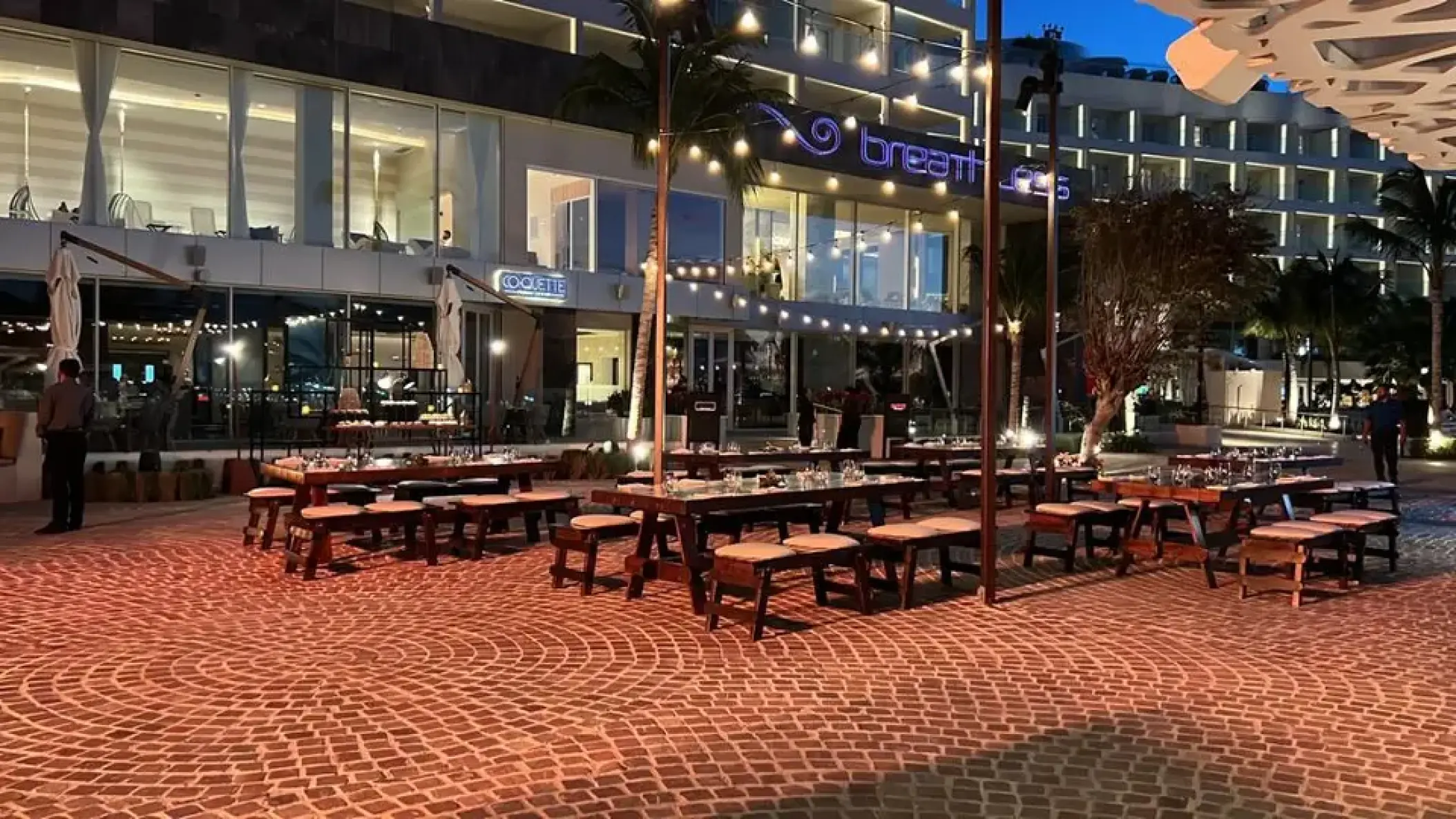 Outdoor terrace with string lights and banquet tables at Breathless Cancun Soul, Cancun