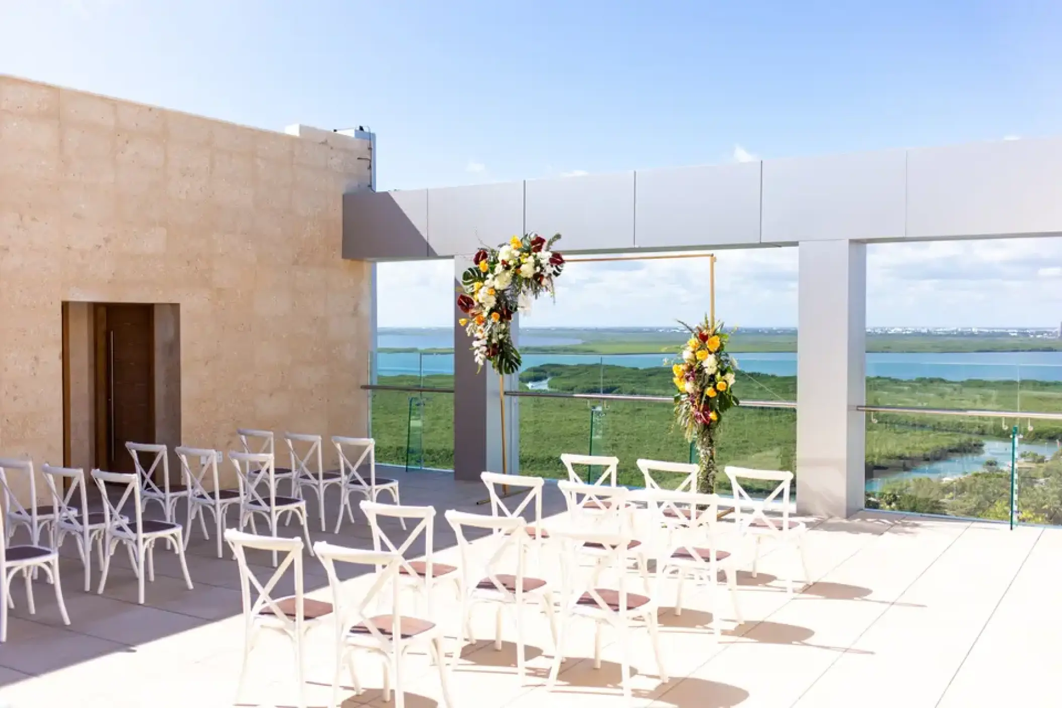 Rooftop wedding ceremony at Breathless Cancun Soul overlooking the lagoon, Cancun