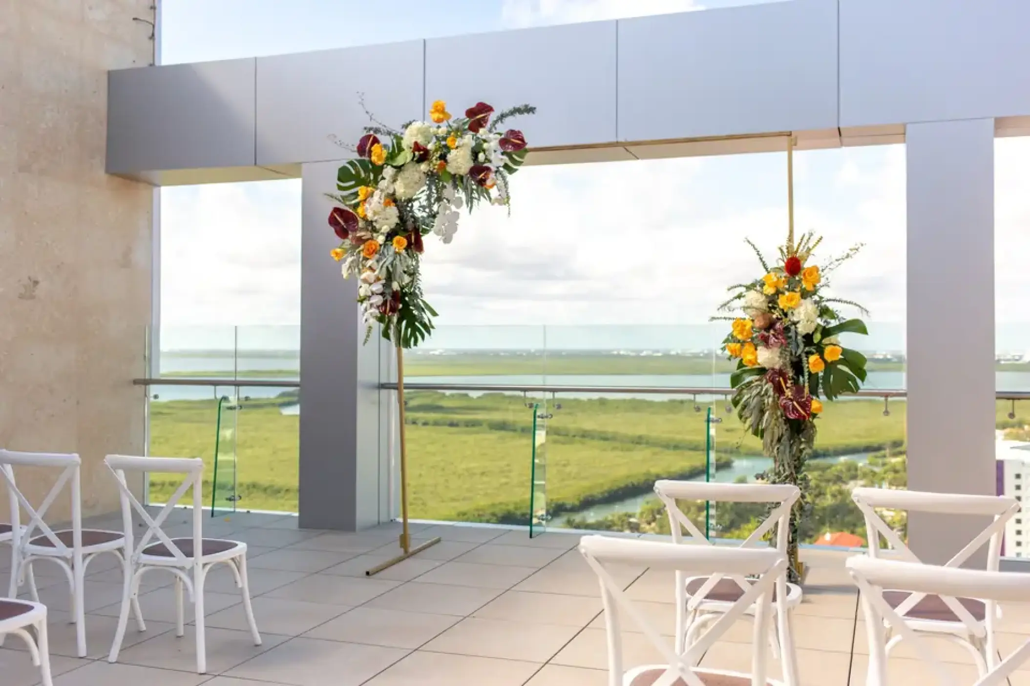 Rooftop wedding ceremony with floral arrangements at Breathless Cancun Soul, Cancun