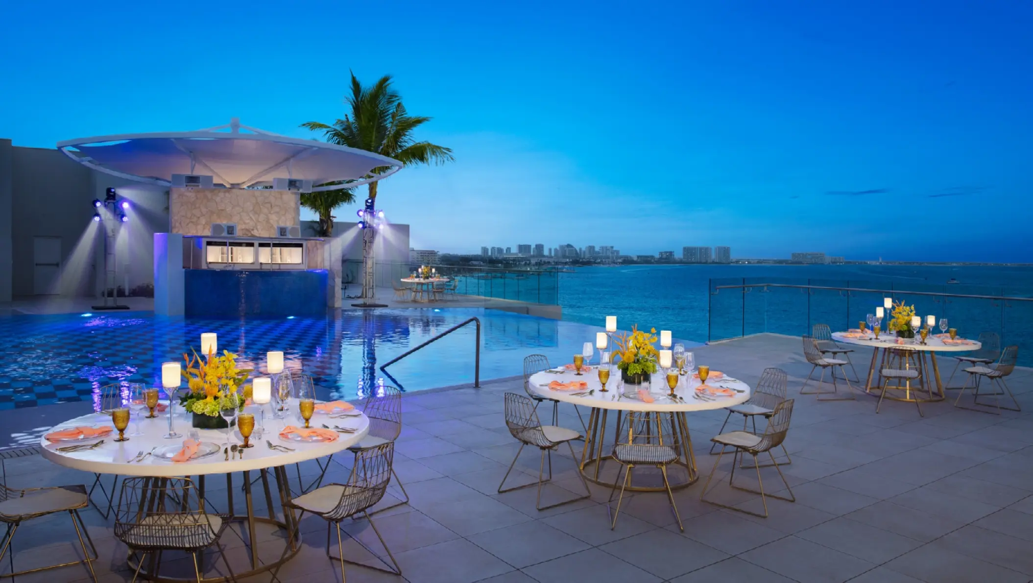 Rooftop terrace wedding reception setup by the pool at Breathless Cancun Soul, Cancun