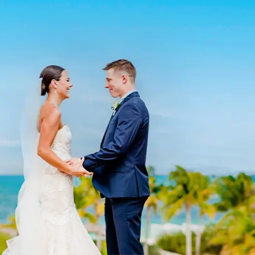 Bride and groom holding hands during a wedding at Majestic Mirage Costa Mujeres, Cancun