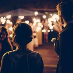 bride and groom and guests holding sparklers