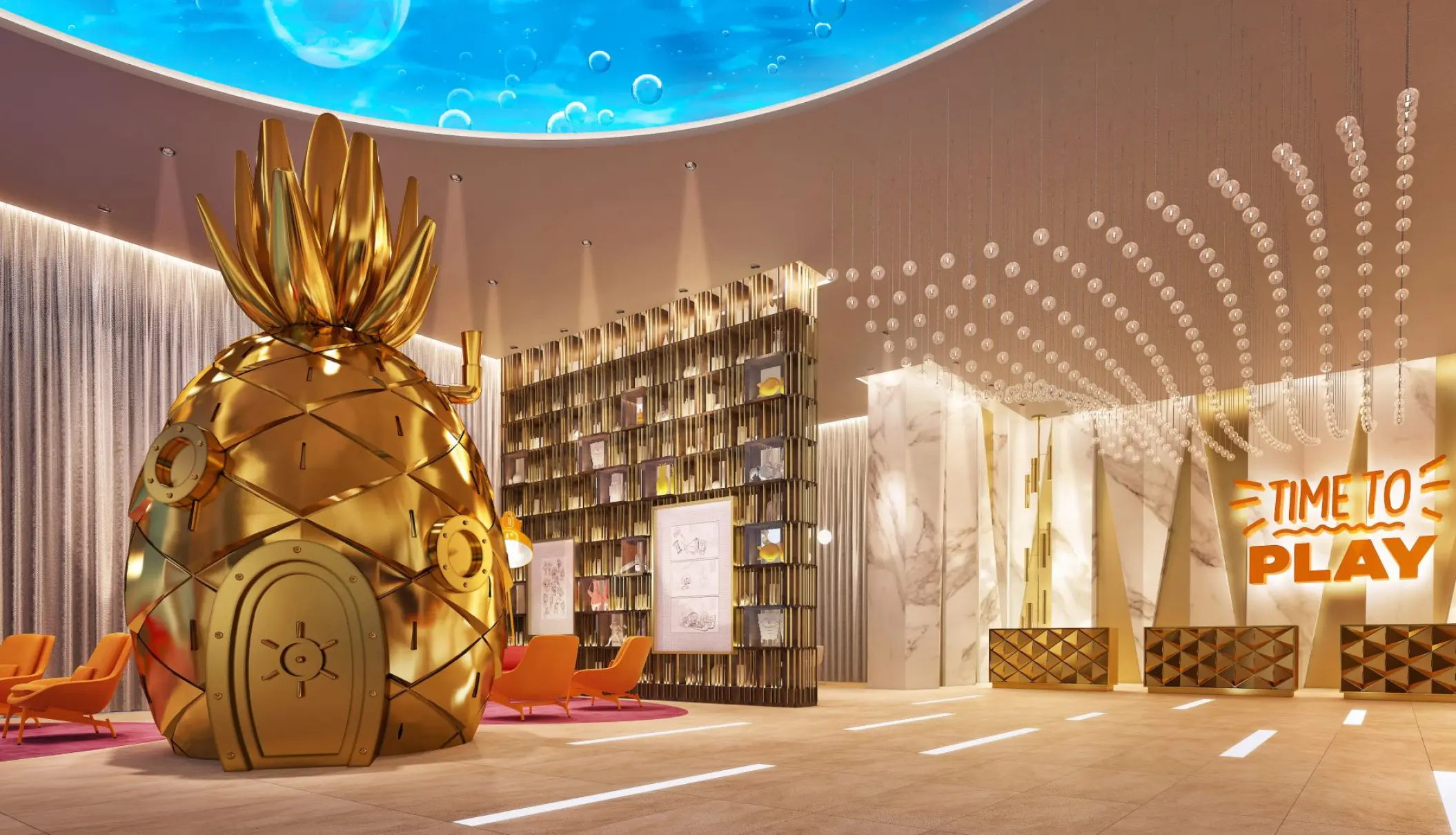 Golden pineapple sculpture in the modern lobby at Nickelodeon Riviera Maya
