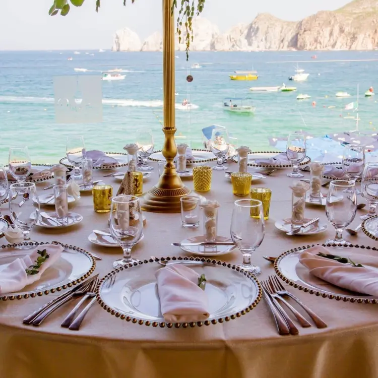 Outdoor wedding reception table setup overlooking the ocean at Casa Dorada, Cabo San Lucas