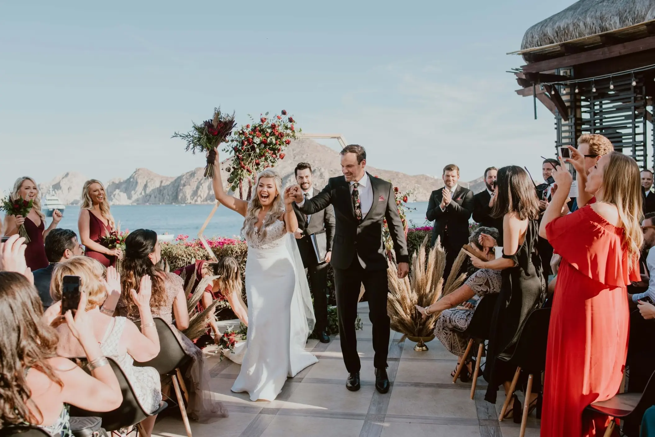 Bride and groom walking down the aisle after a terrace wedding ceremony at Casa Dorada, Cabo San Lucas
