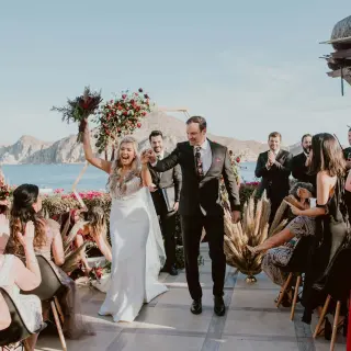 Bride and groom walking down the aisle after a terrace wedding ceremony at Casa Dorada, Cabo San Lucas