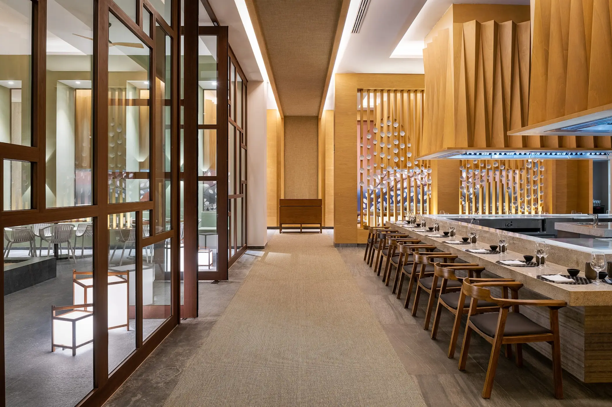 Ayami restaurant interior with wood accents and teppanyaki seating at Catalonia Grand Costa Mujeres, Cancun