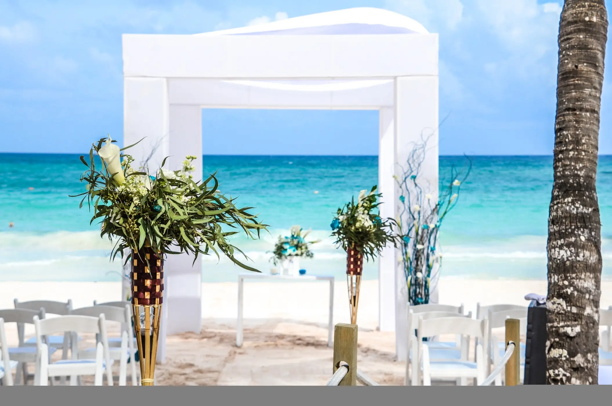Beachfront wedding ceremony with white gazebo at Catalonia Grand Costa Mujeres, Cancun
