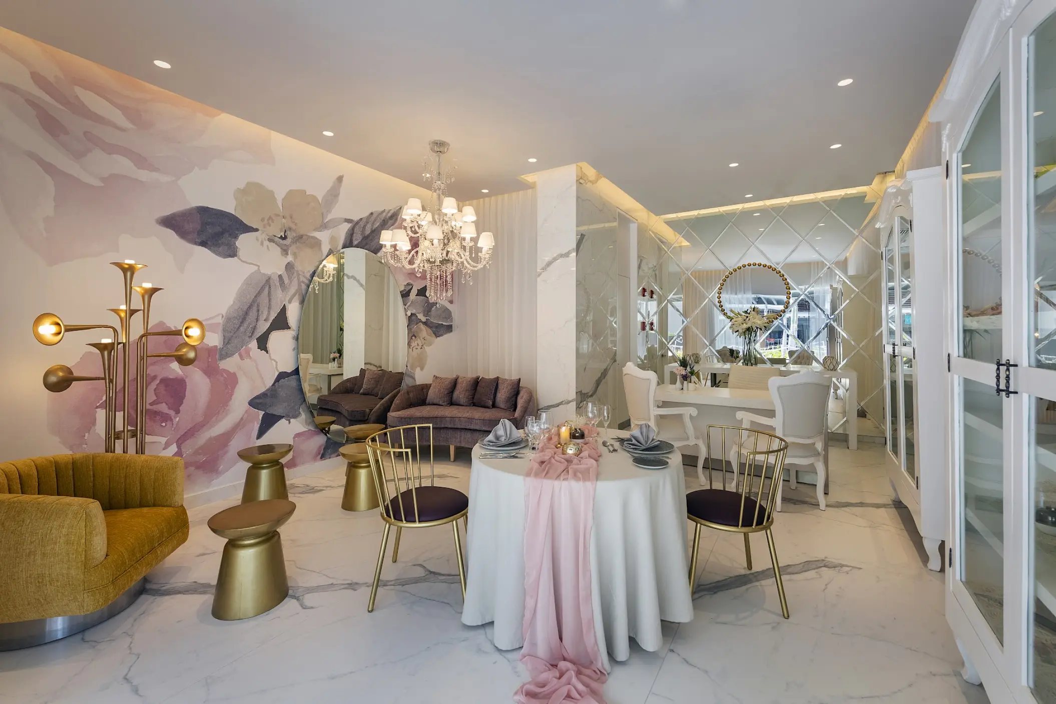 Bridal suite with floral mural and elegant seating at Catalonia Grand Costa Mujeres, Cancun