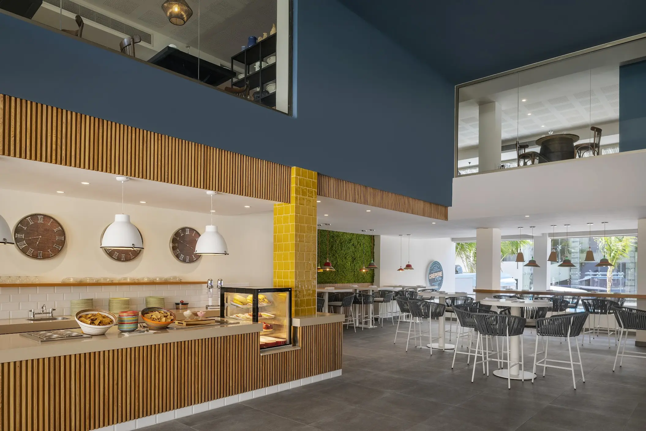 Modern indoor creperie and cafe area at Catalonia Grand Costa Mujeres, Cancun
