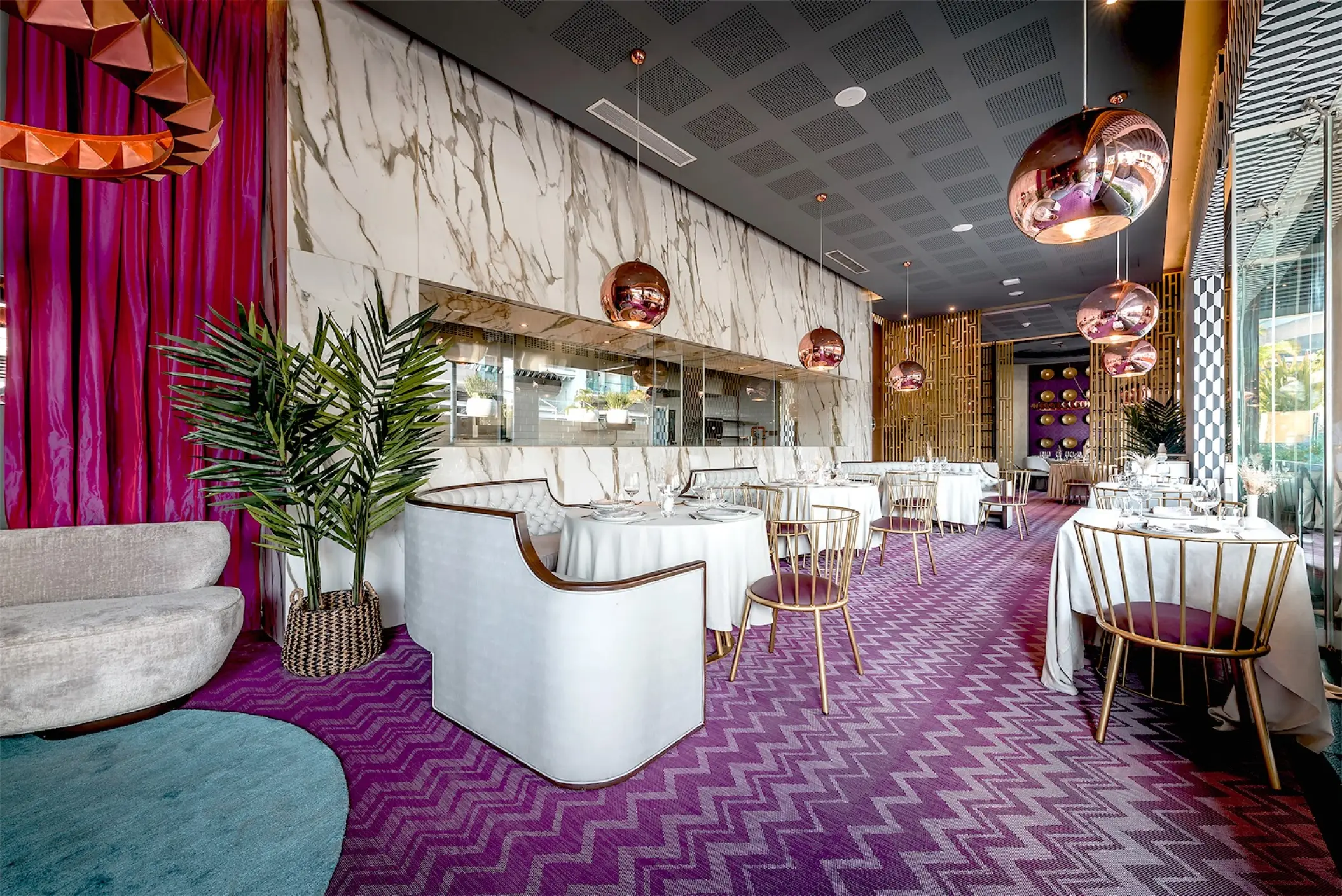 Memories restaurant with white tables and purple patterned flooring at Catalonia Grand Costa Mujeres, Cancun