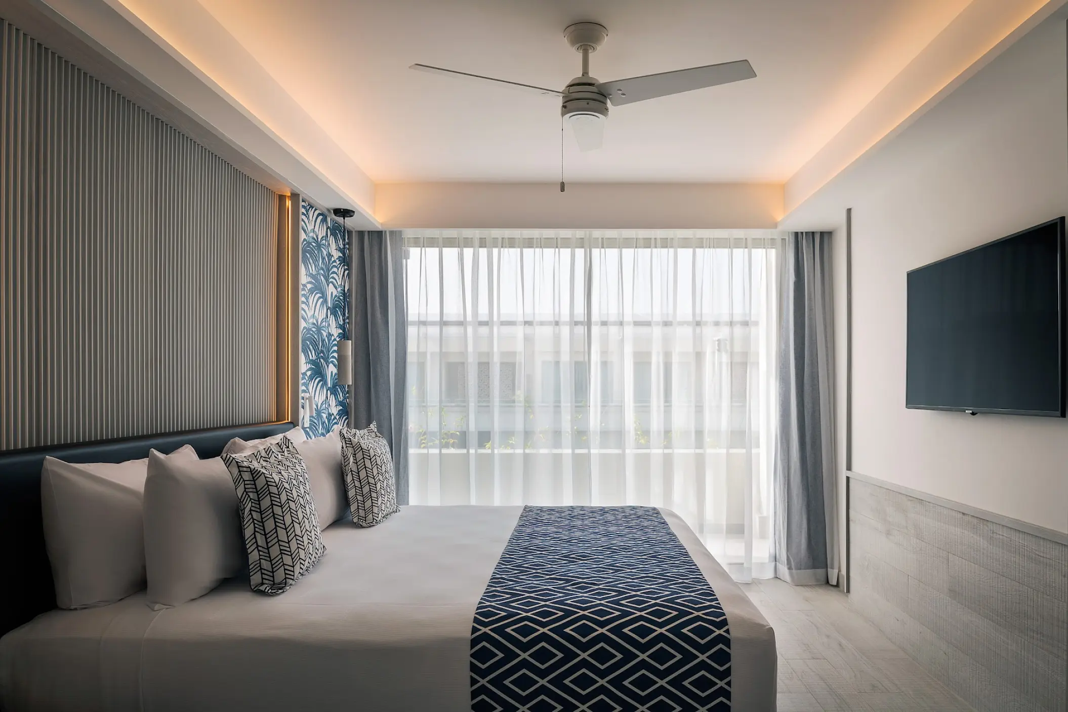 Modern guest suite with private balcony at Catalonia Grand Costa Mujeres, Cancun