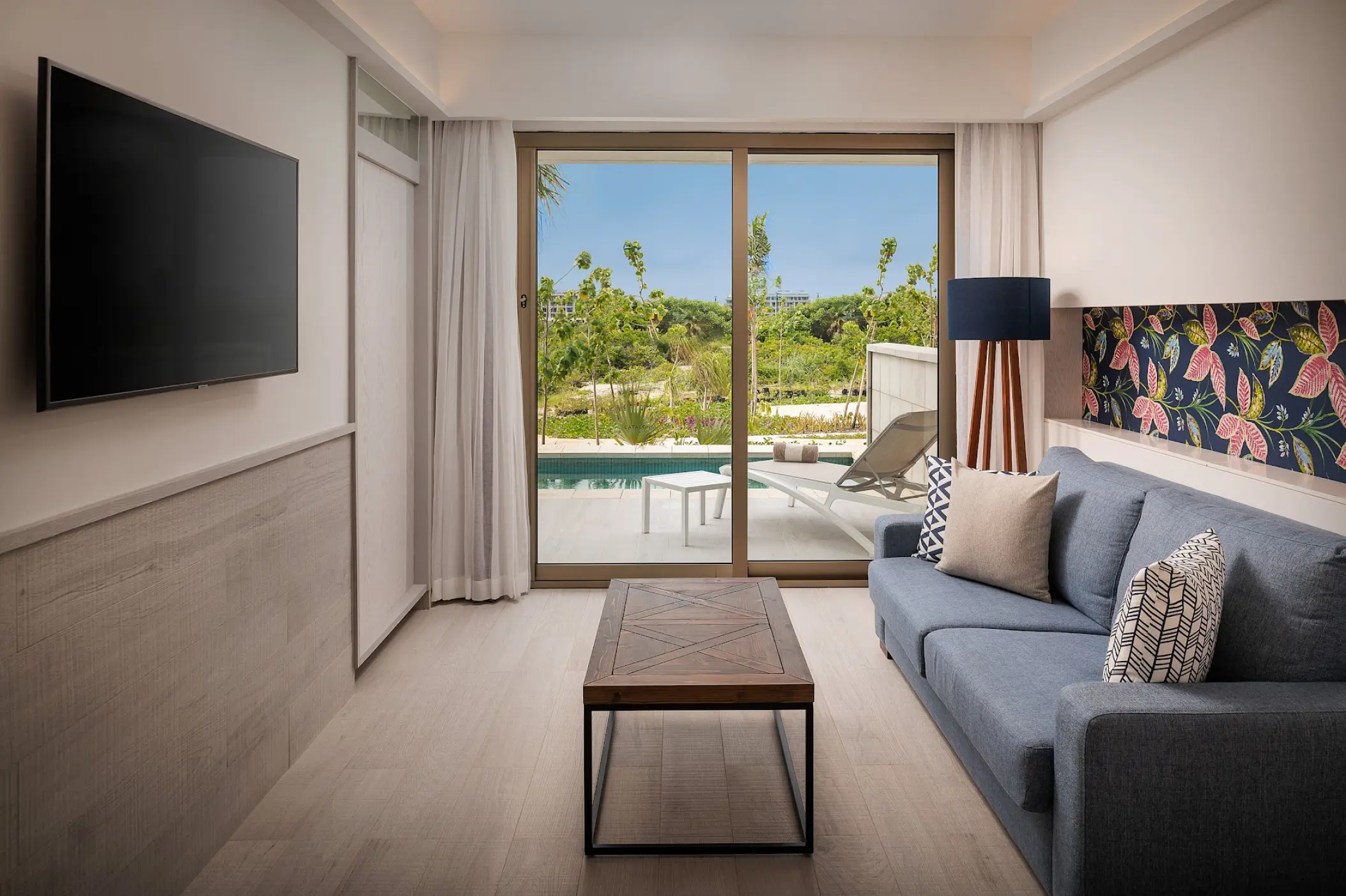 Swim-up suite living area with terrace and pool view at Catalonia Grand Costa Mujeres, Cancun