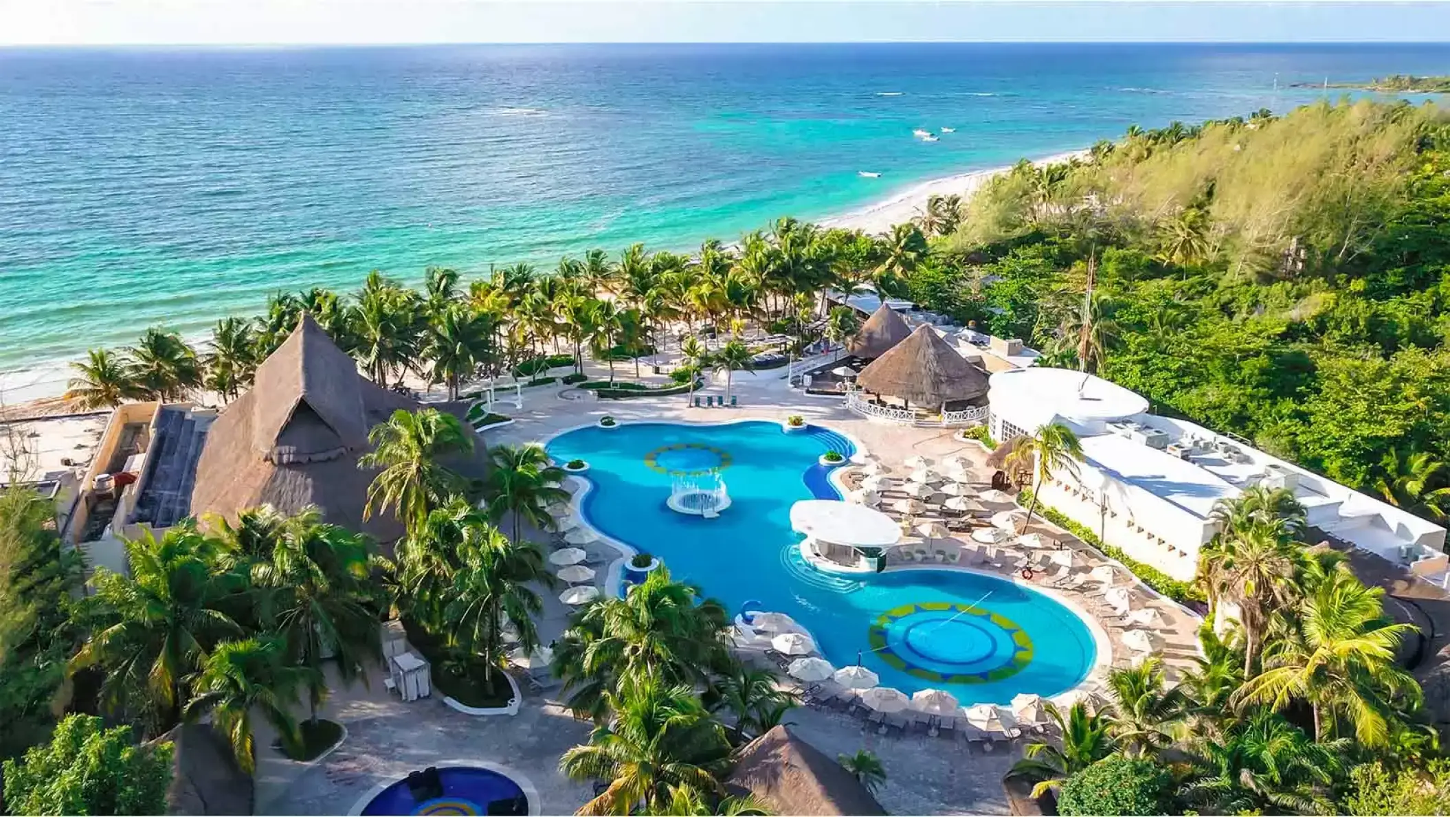 Aerial view of Catalonia Royal Tulum beachfront pools and turquoise ocean, Tulum