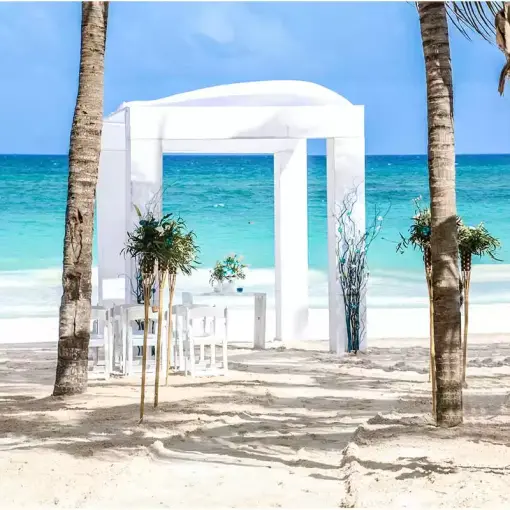 White beachfront wedding ceremony gazebo at Catalonia Royal Tulum