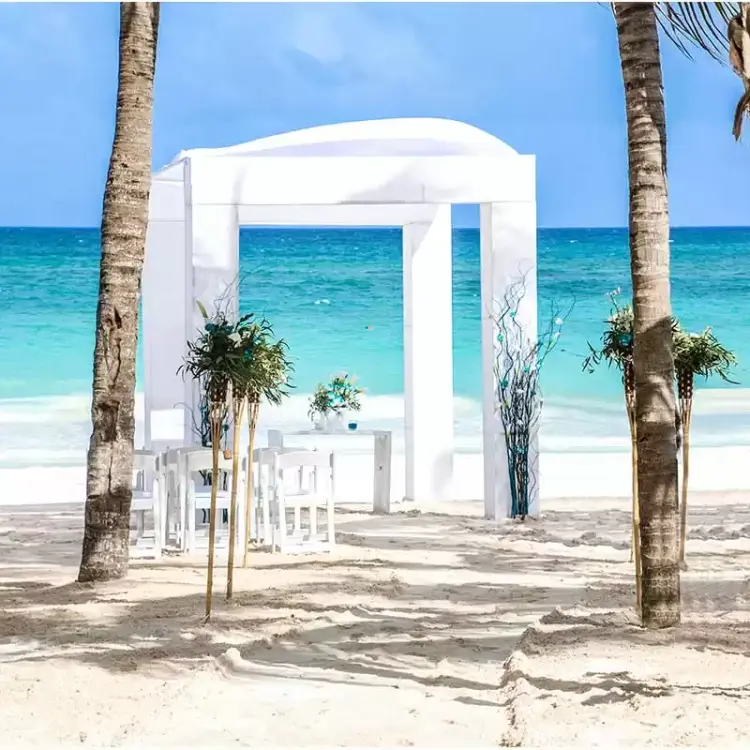 White beachfront wedding ceremony gazebo at Catalonia Royal Tulum