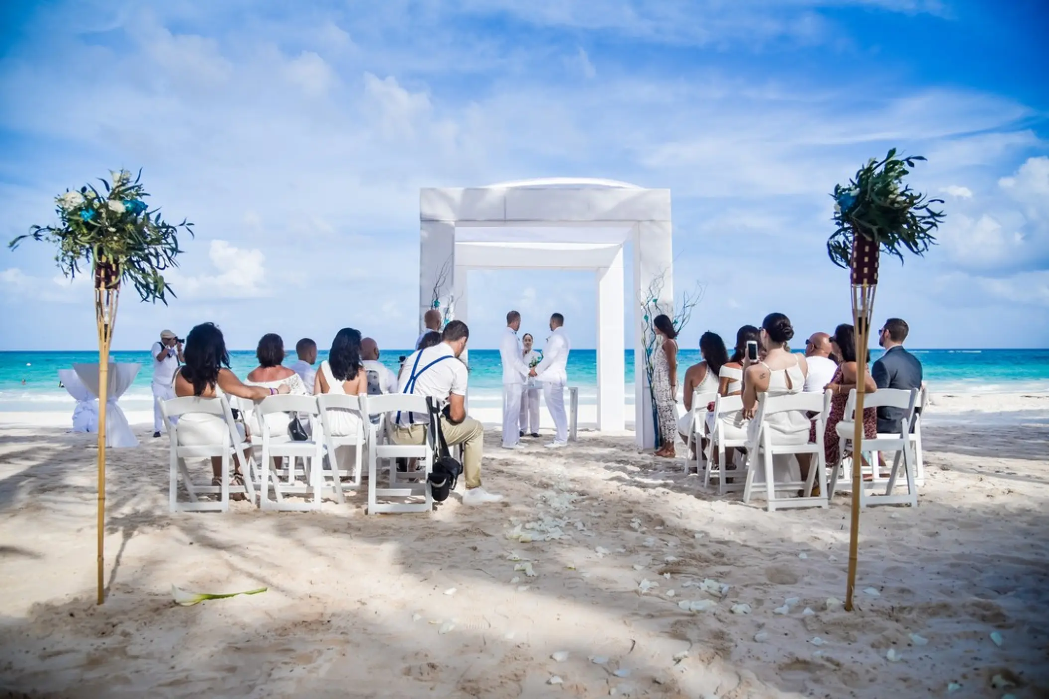 Beachfront wedding ceremony with a white gazebo at Catalonia Royal Tulum, Tulum