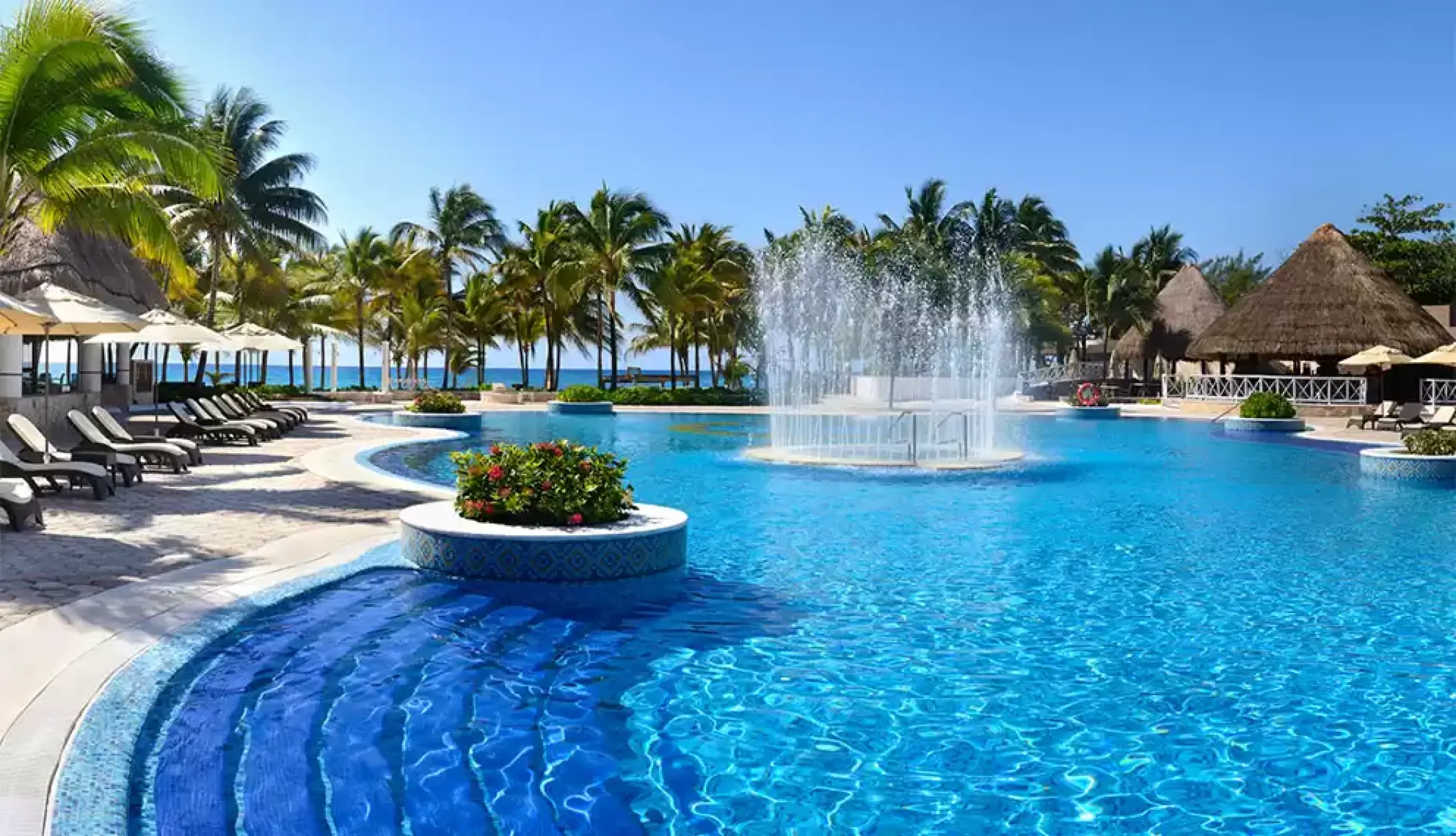 Catalonia Royal Tulum main swimming pool with a central water fountain, Tulum