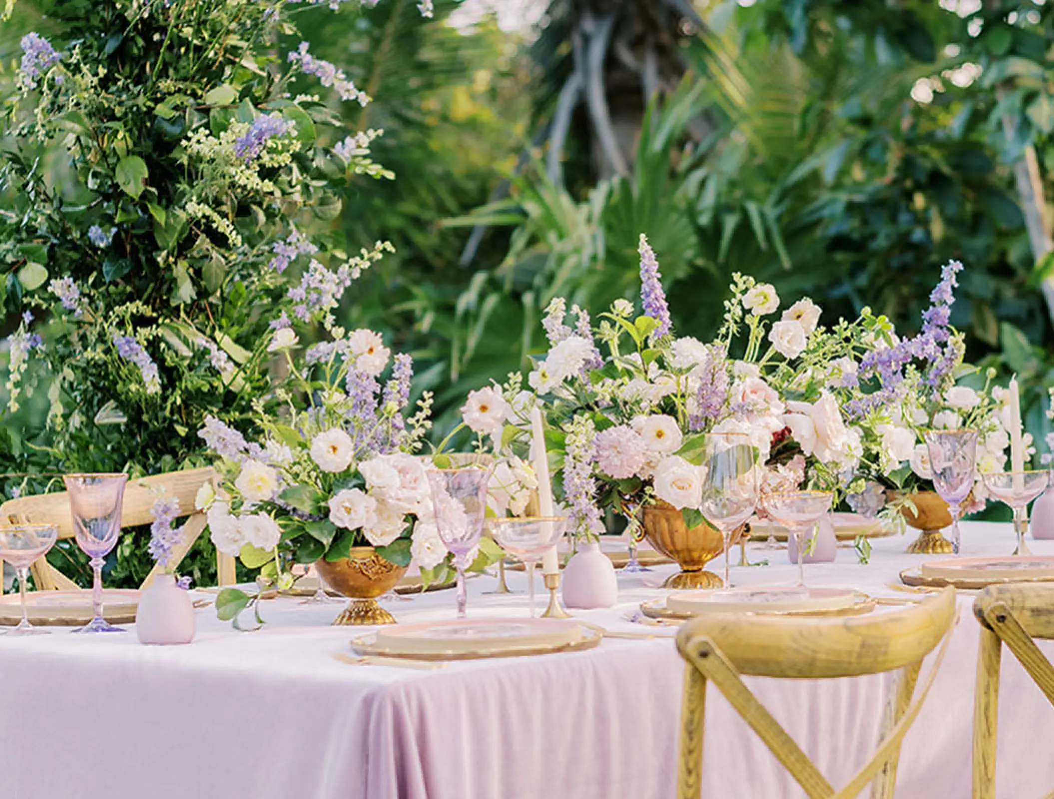 Floral wedding reception table setup at Conrad Tulum, Tulum