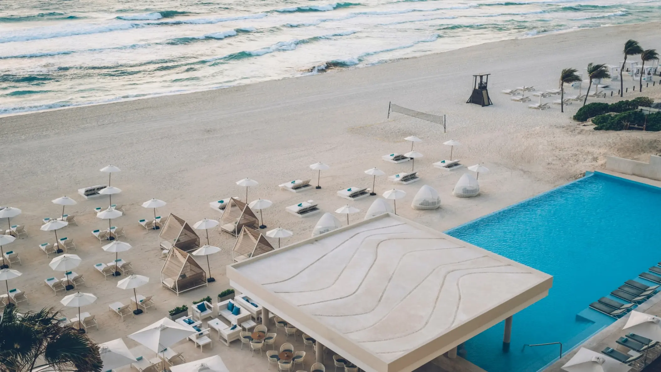 Aerial view of the beach club and infinity pool at Coral Level at Iberostar Selection Cancun