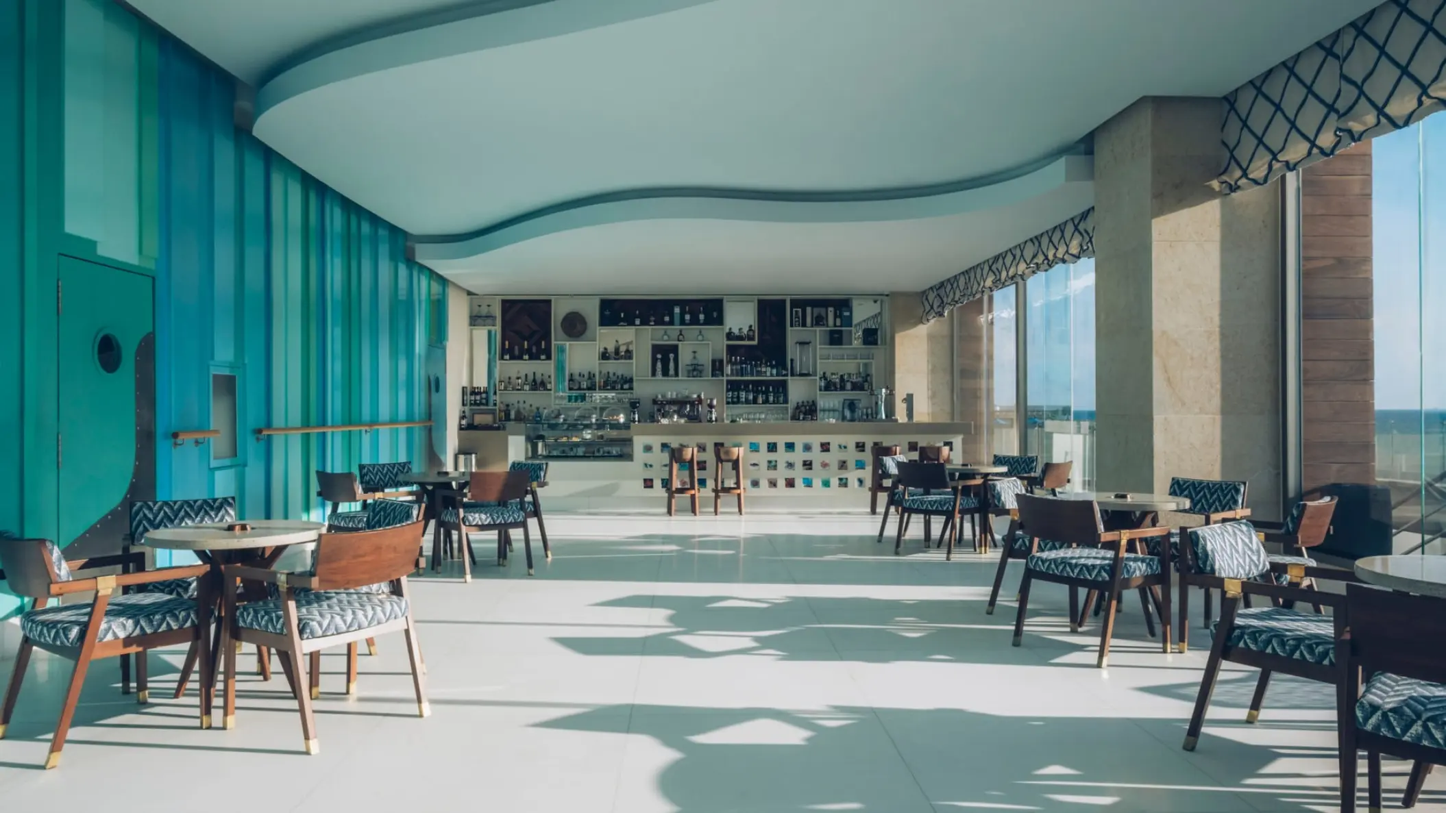 Modern restaurant and bar with ocean views at Coral Level at Iberostar Selection Cancun