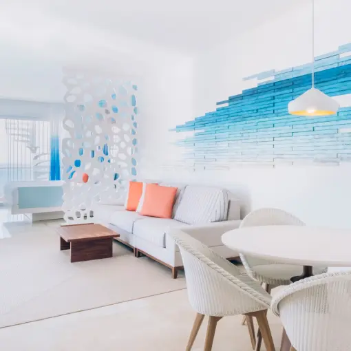 Modern suite living and dining area at Coral Level at Iberostar Selection Cancun