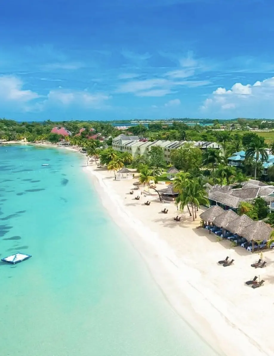 Aerial view of white sand beach and turquoise water in Negril, Jamaica