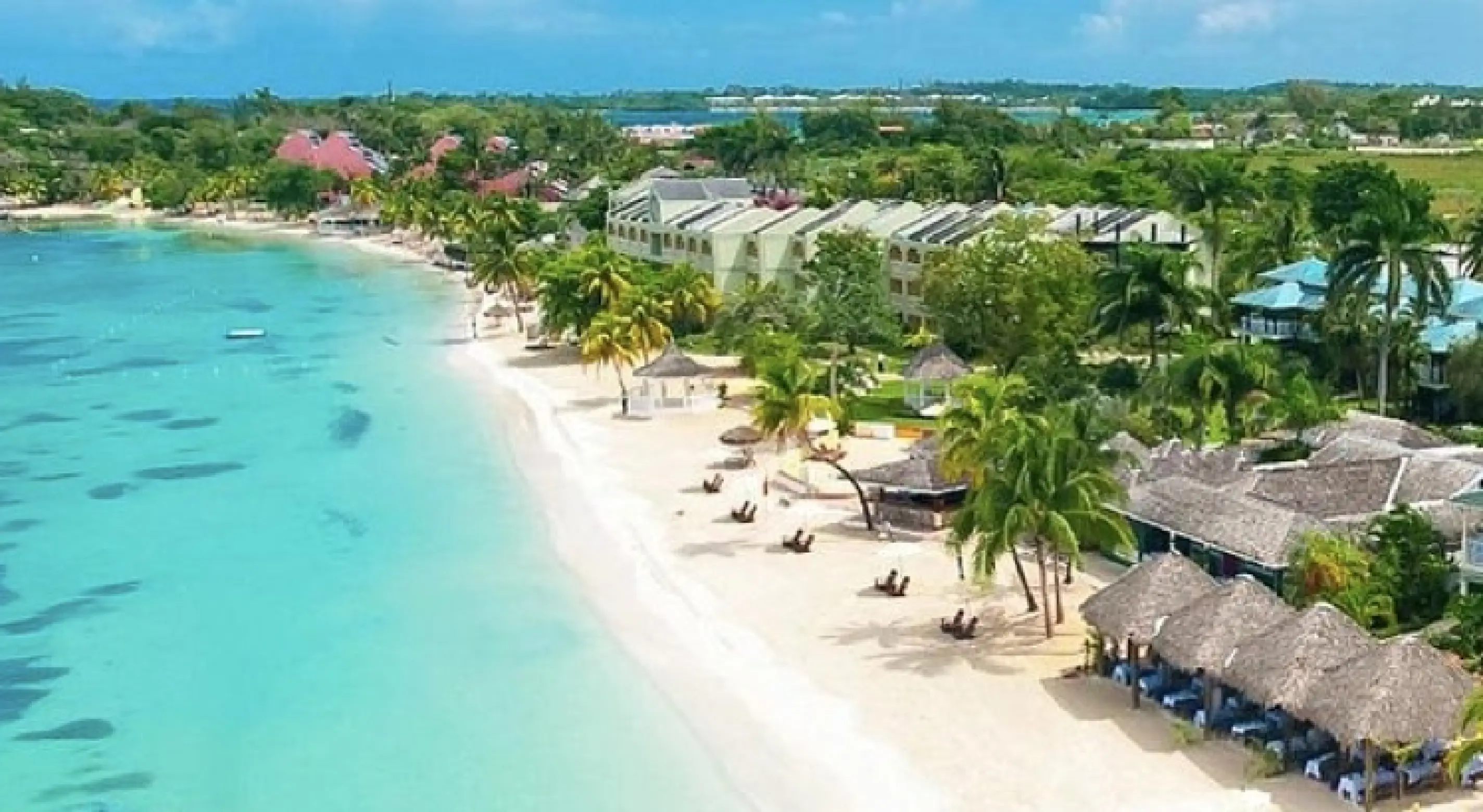 Aerial view of white sand beach and turquoise water in Negril, Jamaica