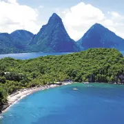 Aerial view of a secluded cove and lush mountains in Grenada