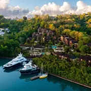Aerial view of a coastal resort and marina nestled in lush tropical hills, Saint Lucia