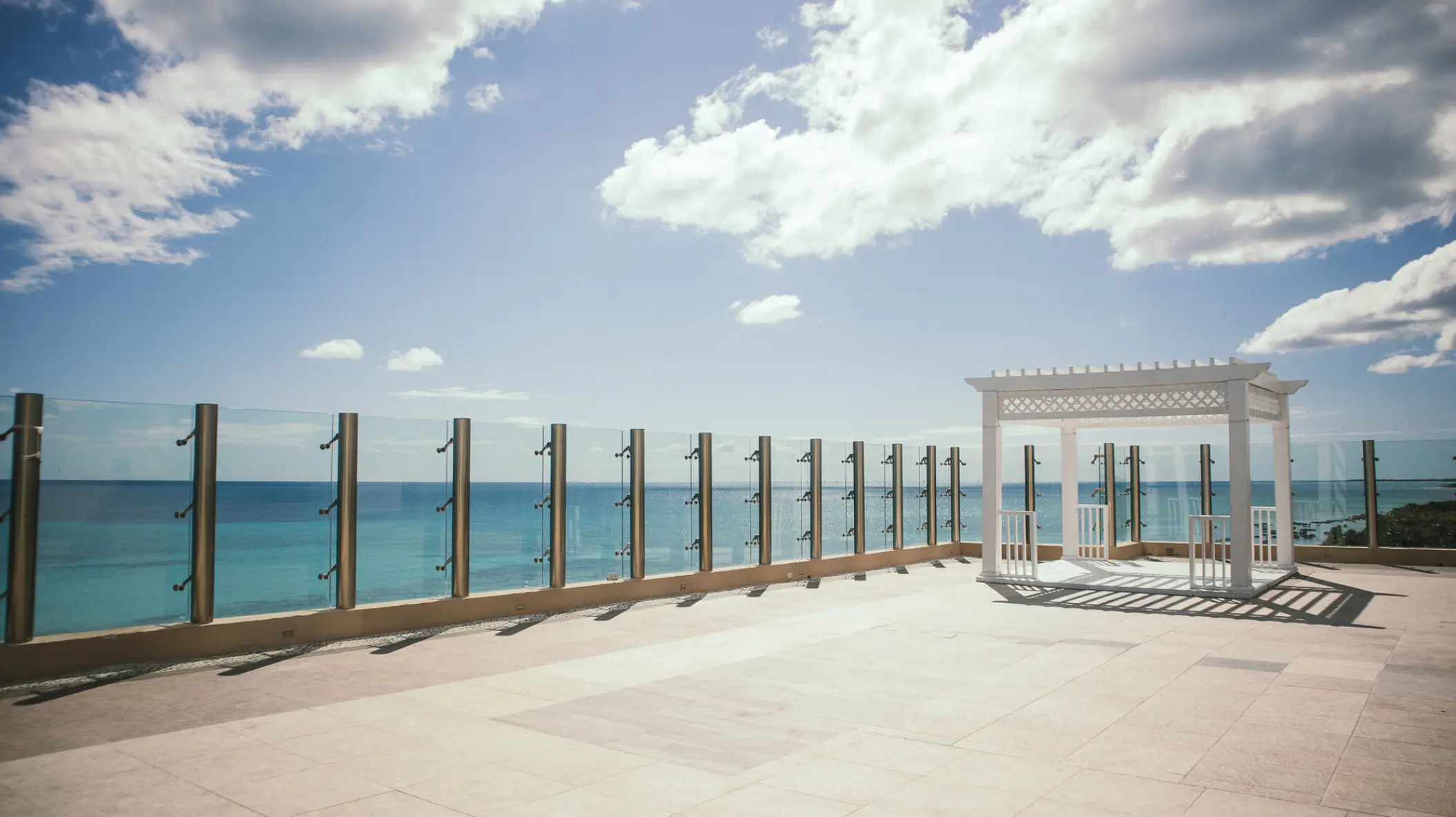 Sky deck wedding ceremony gazebo overlooking the ocean at El Dorado Casitas Royale, Riviera Maya