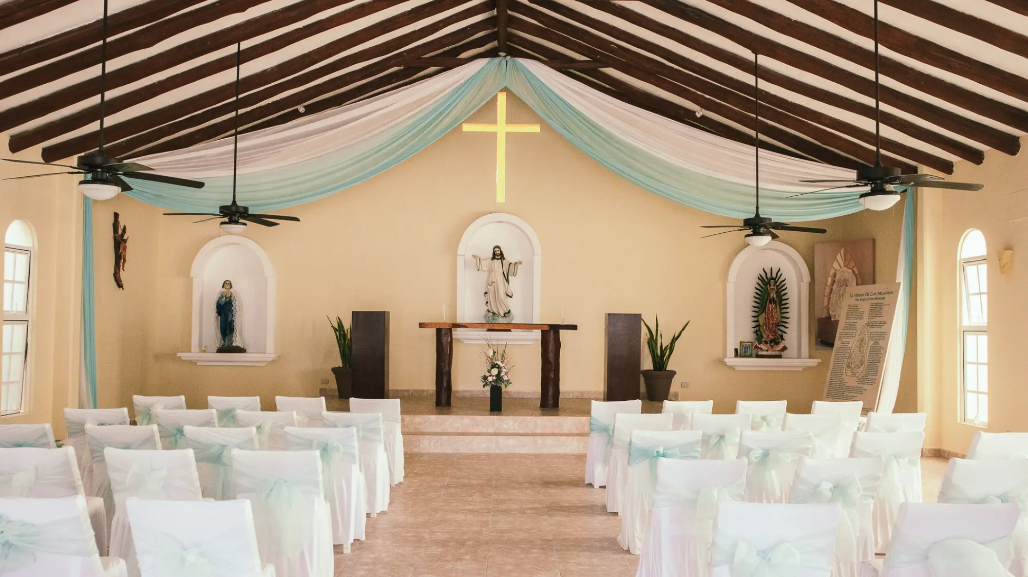 Indoor chapel wedding ceremony at El Dorado Maroma, Riviera Maya