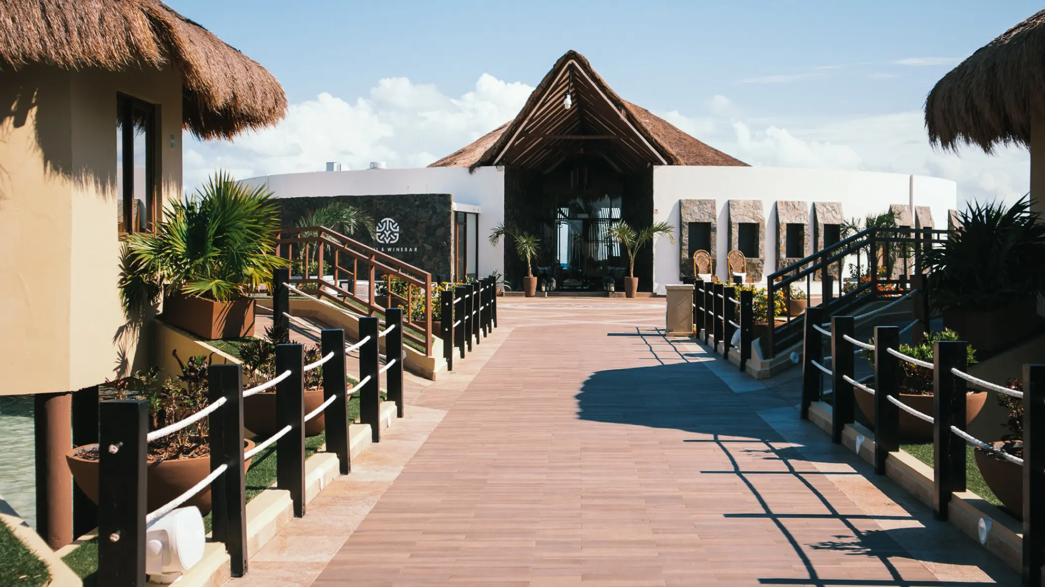 El Dorado Maroma walkway and thatched-roof bungalow suites, Riviera Maya