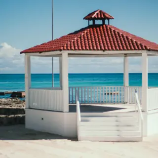 Oceanfront wedding gazebo with red tiled roof at El Dorado Royale, Riviera Maya