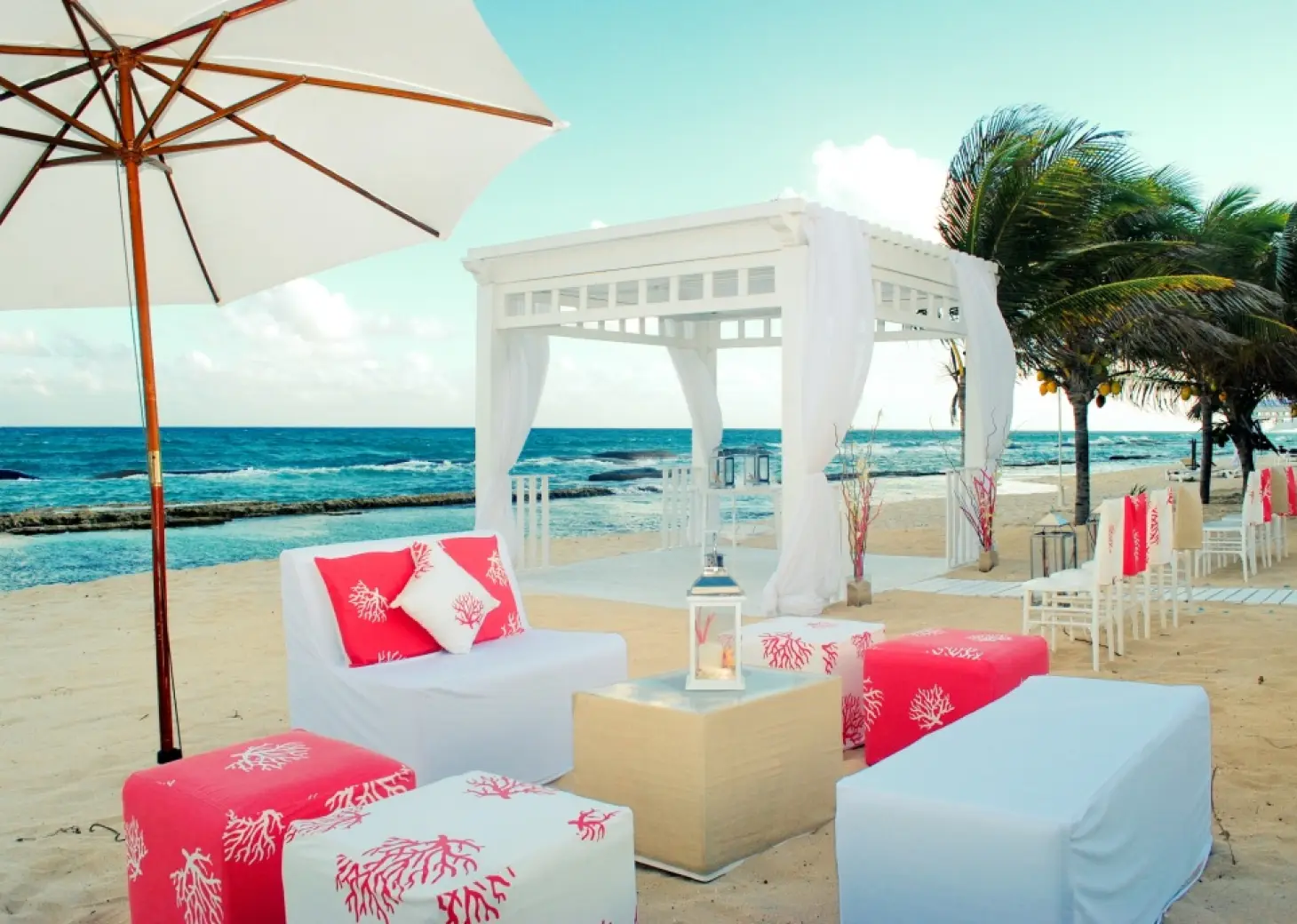 Beachfront wedding ceremony gazebo and lounge seating at El Dorado Royale, Riviera Maya