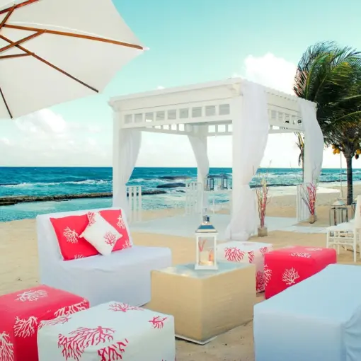 Beachfront wedding ceremony gazebo and lounge seating at El Dorado Royale, Riviera Maya